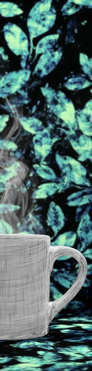 Free printable coffee in front of green leaves bookmark